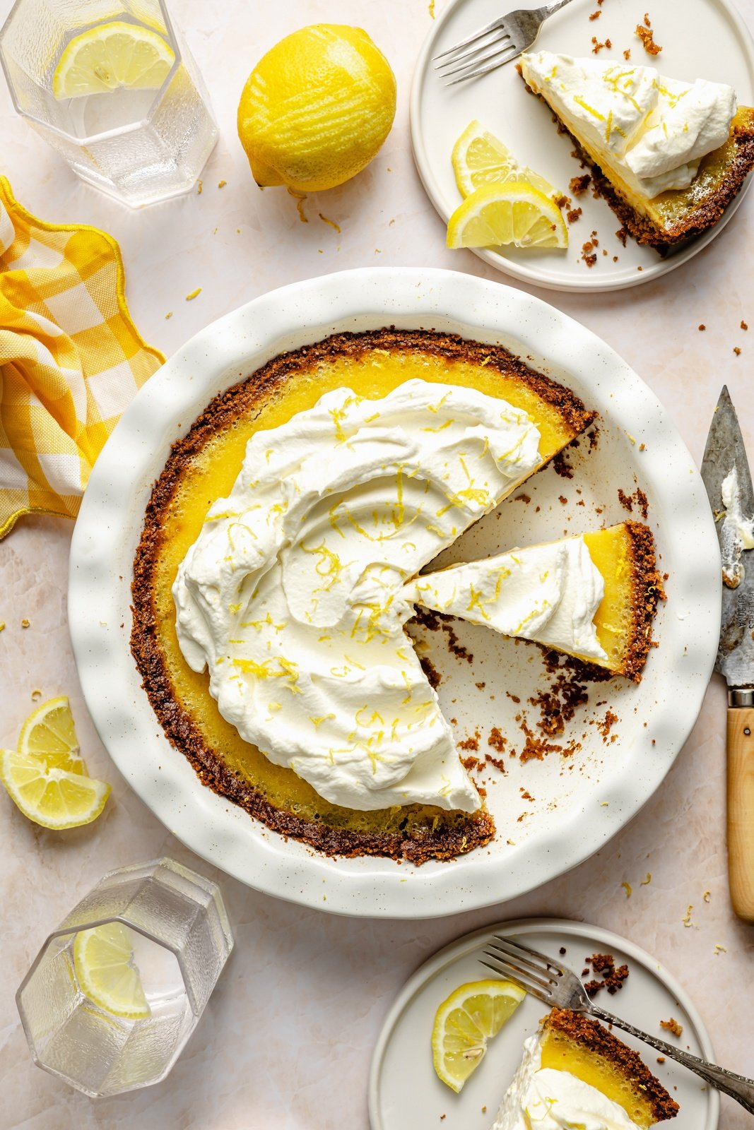 lemon cream pie sliced in a pie dish