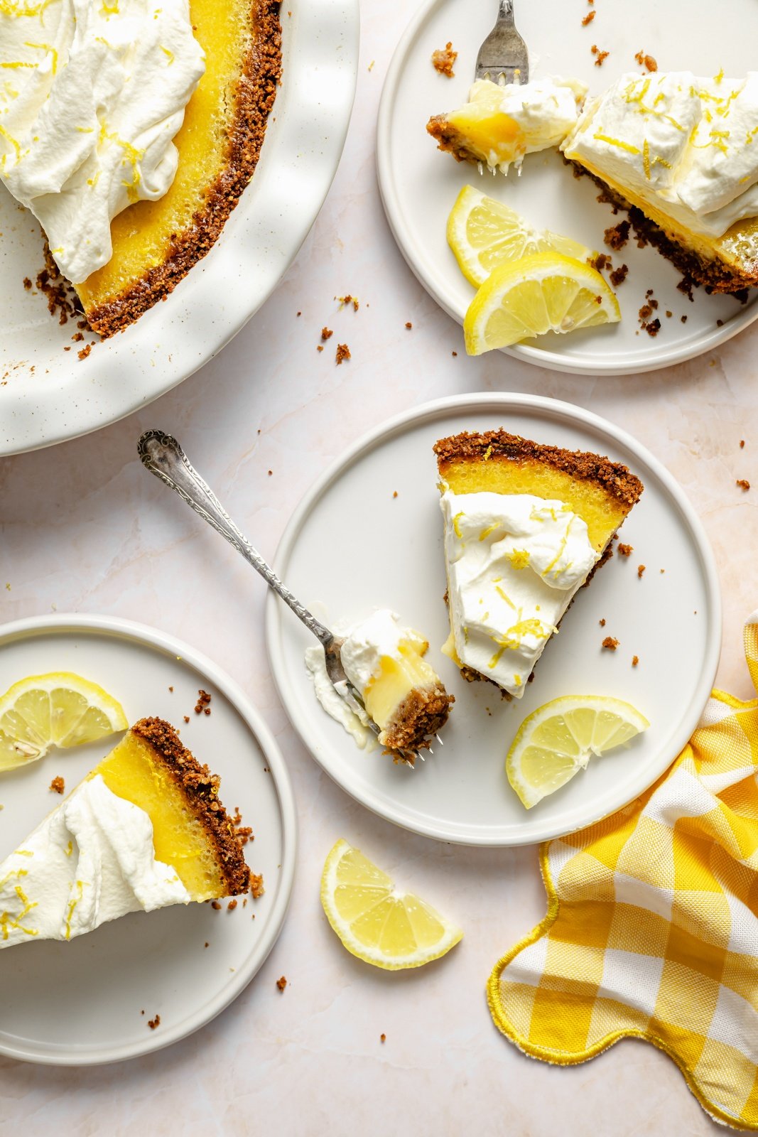 slices of lemon cream pie on plates