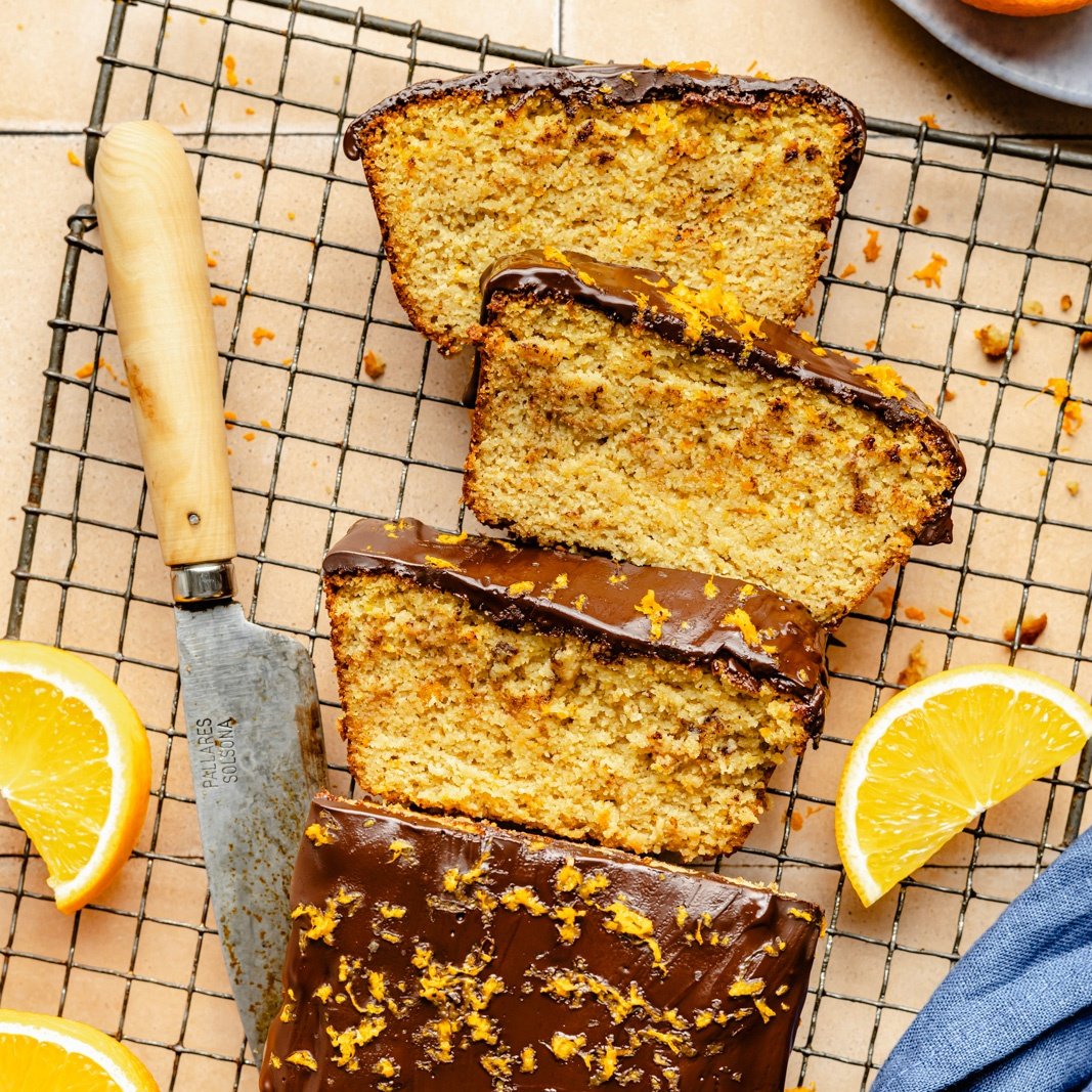 orange loaf with chocolate glaze on a wire rack