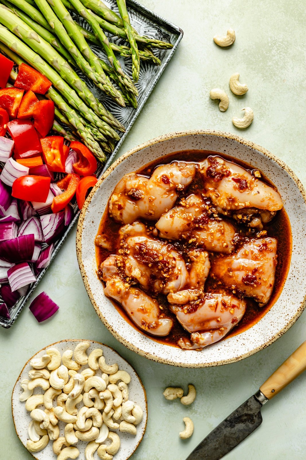 ingredients for sheet pan sesame chicken and vegetables in bowls