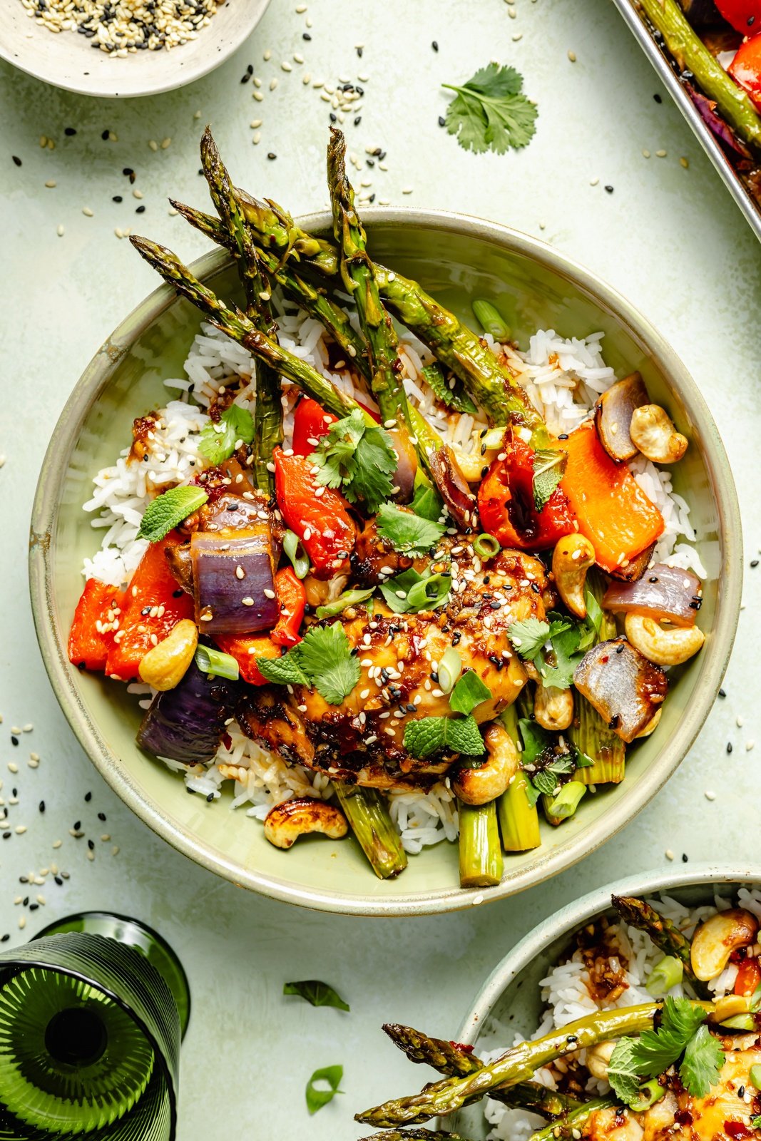 sesame chicken and vegetables in a bowl with rice