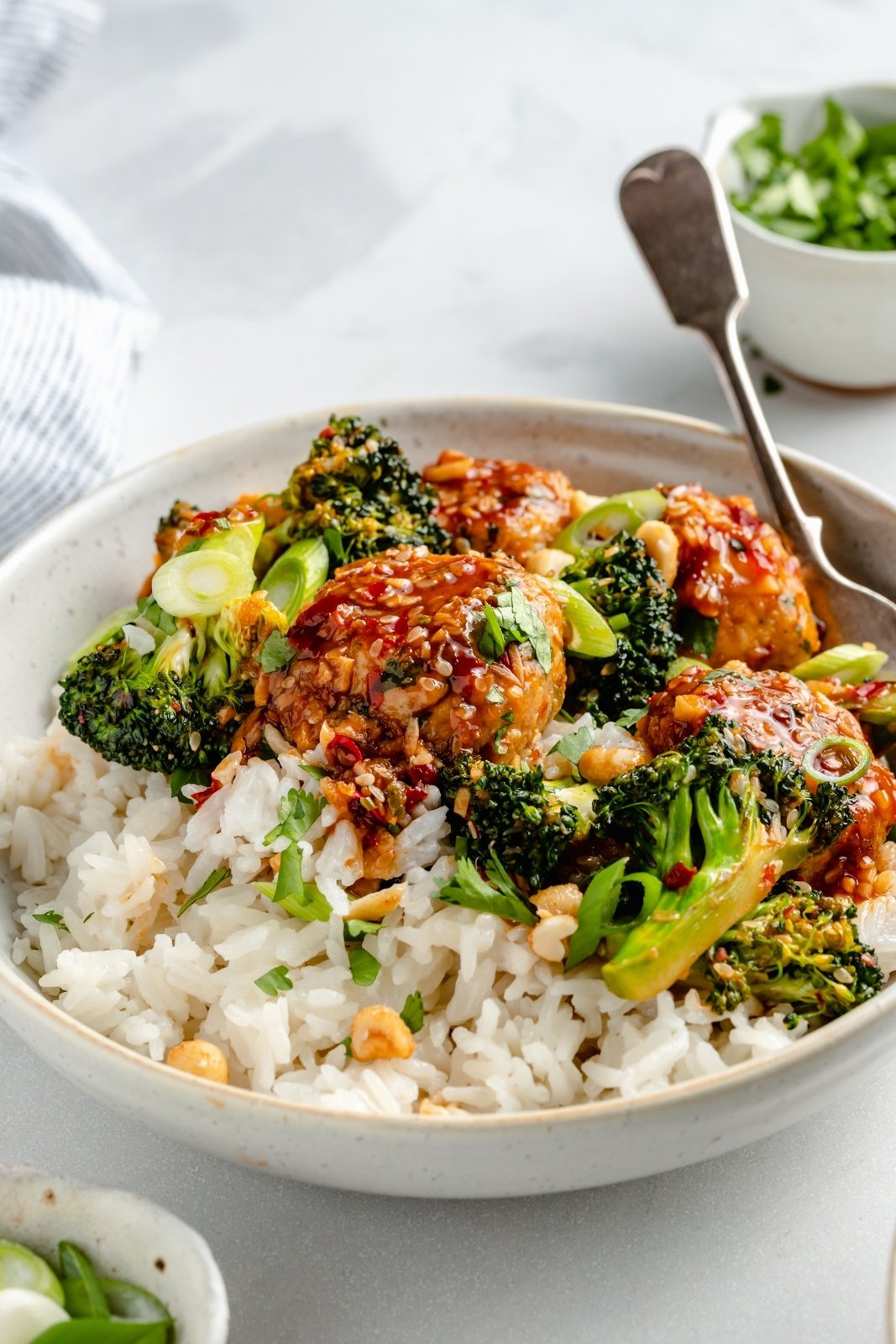 sesame chicken meatball bowls with broccoli and rice