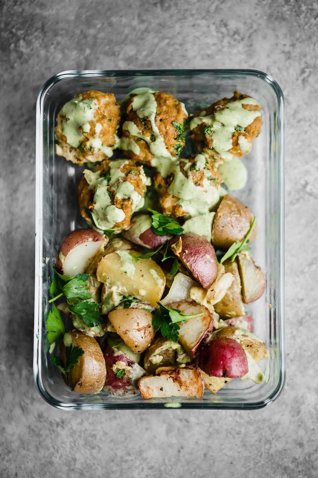 paleo turmeric chicken meatballs in a meal prep container