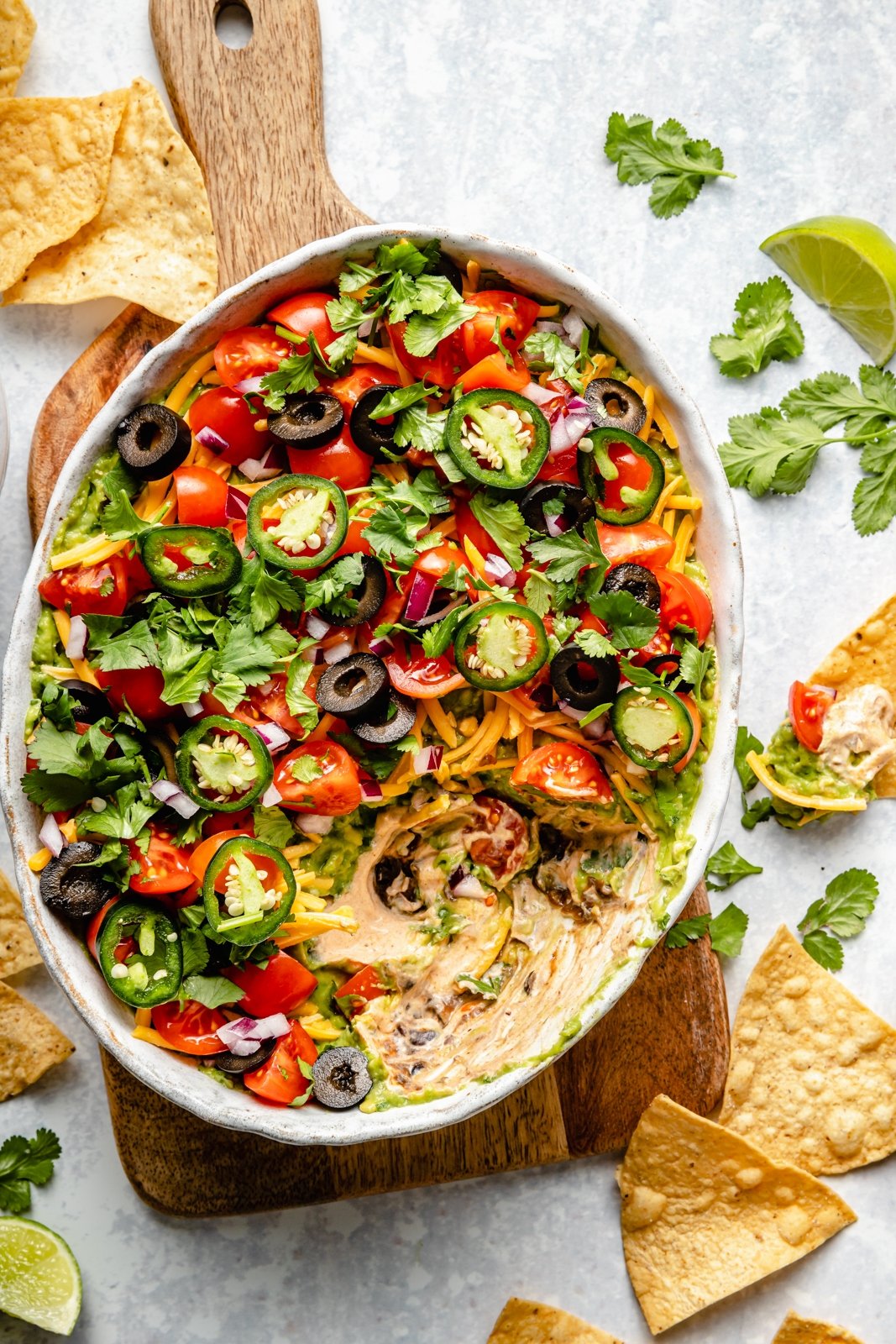 healthy 7-layer dip in a serving bowl