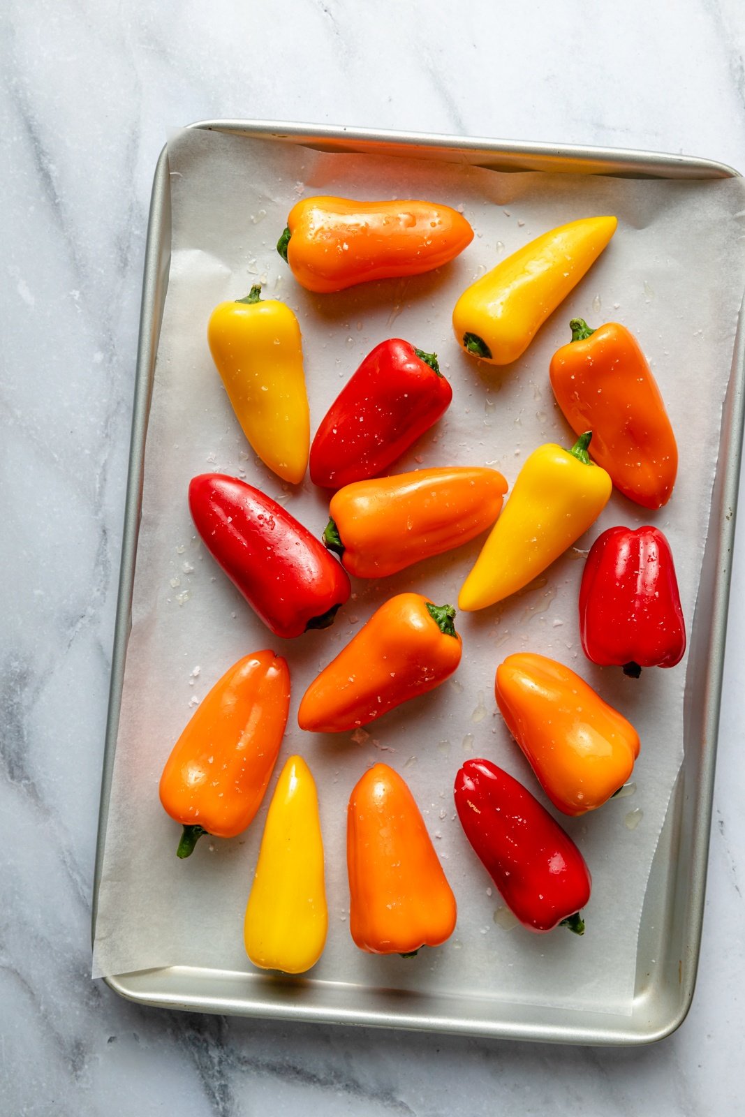 mini sweet peppers on a baking sheet