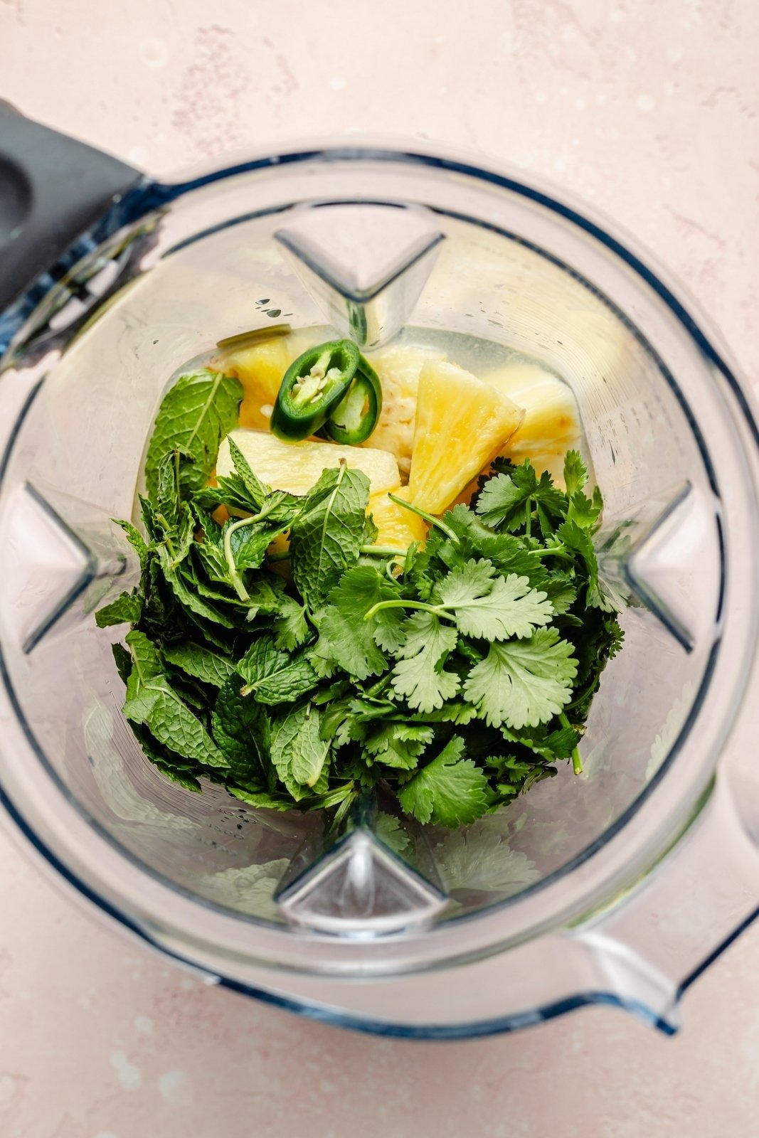 ingredients for a spiked green juice in a blender