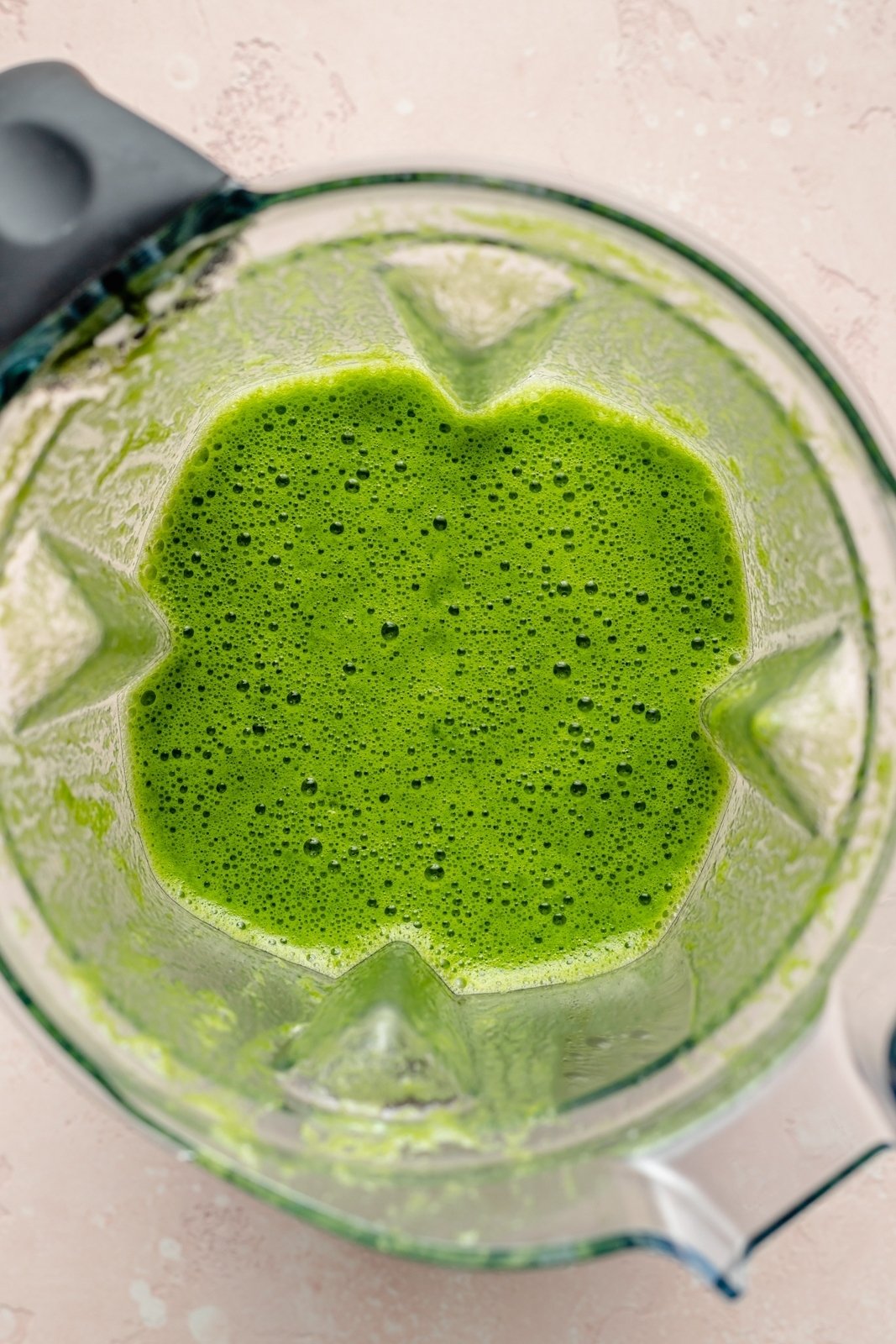 a green margarita blended in a blender