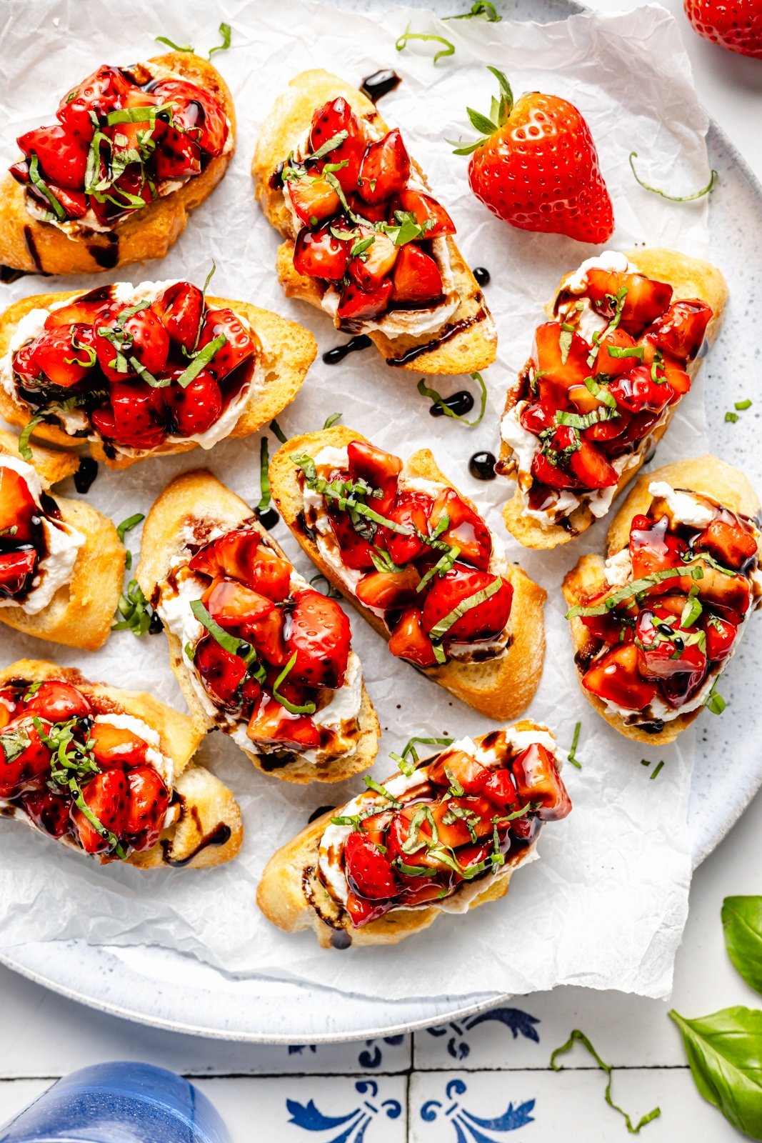strawberry bruschetta with balsamic glaze on a platter